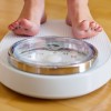 Link Between Sleep Apnea and Weight Loss Still Unclear woman on scale