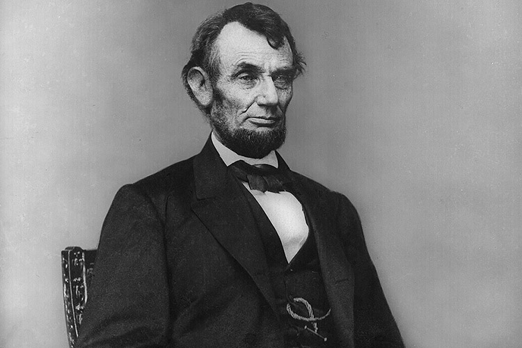 Abraham_Lincoln_seated_Feb_9_18641