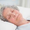 elderly senior citizen woman sleeping well and happily