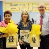 Source: The Leader News, Harvard Elementary Principal Kevin Beringer with Raiza Jan (left) and Elizabeth Suneby (center)